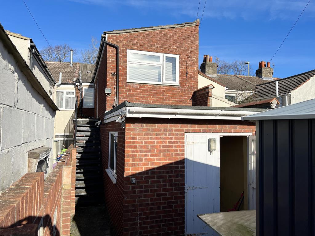 Lot: 18 - FREEHOLD MIXED USE PROPERTY WITH PLANNING FOR CONVERSION - Rear elevation and staircase leading to flat